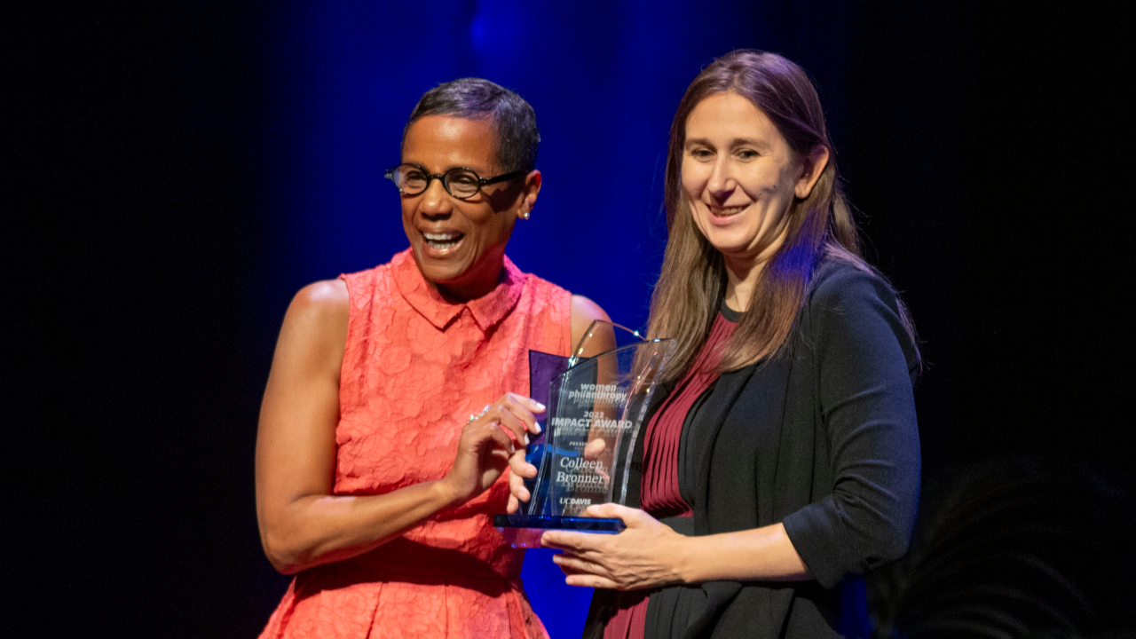 LeShelle May presents Colleen E. Bronner, associate professor of teaching, with the 2023 Women & Philanthropy Impact Award on Sunday (Nov. 5).