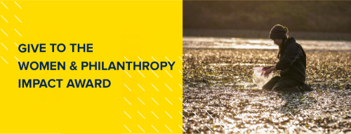 A researcher collecting samples in a river with text that reads "Give to the Women & Philanthropy Impact Award"