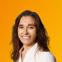 Portrait of Kimberly S. Budil smiling against a yellow and orange gradient background.