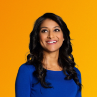 Portrait of Rinki Sethi smiling against an orange and yellow gradient background.