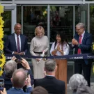 Diane Bryant ’85 cuts the ribbon to open the Engineering Student Design Center that bears her name as Chancellor Gary S. May, mechanical engineering major Tichada Tantasirikorn and Dean Richard Corsi look on. (José Luis Villegas/UC Davis)